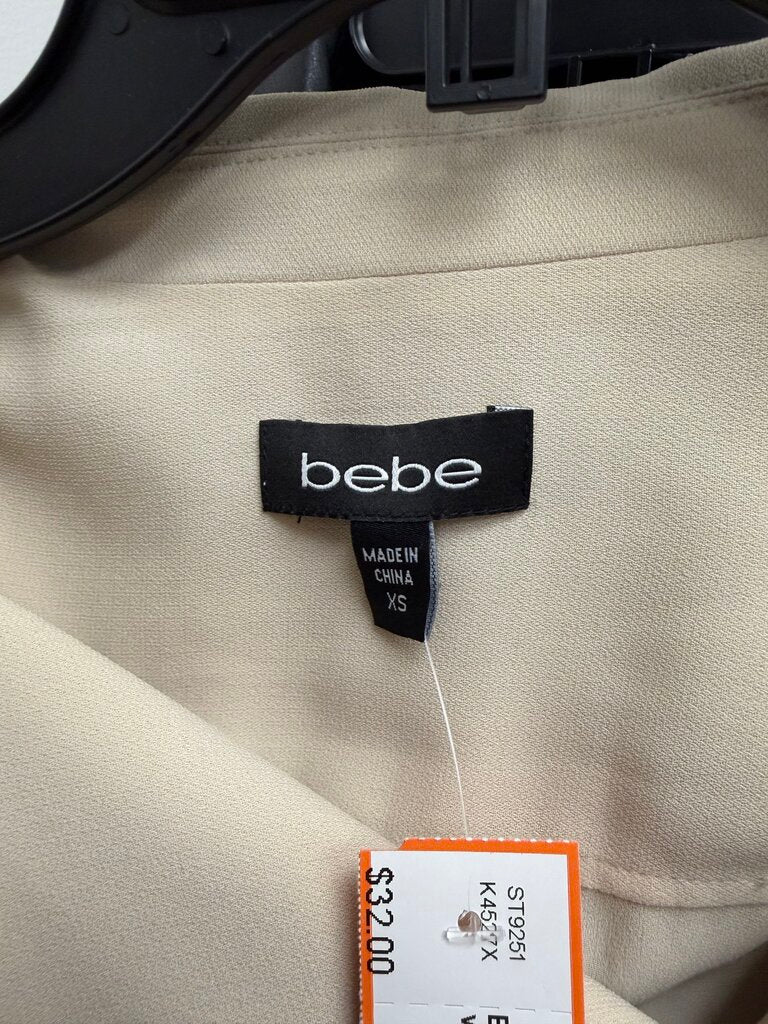 Bebe cream sleeveless dress with zip front