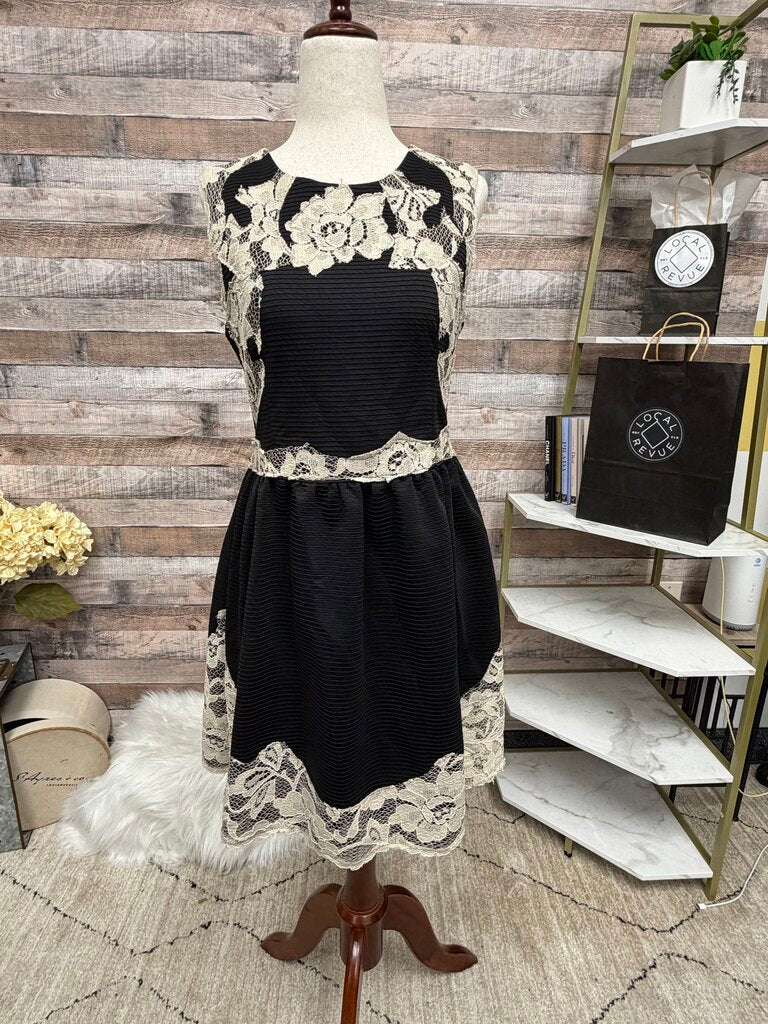 Black cocktail dress with cream lace
