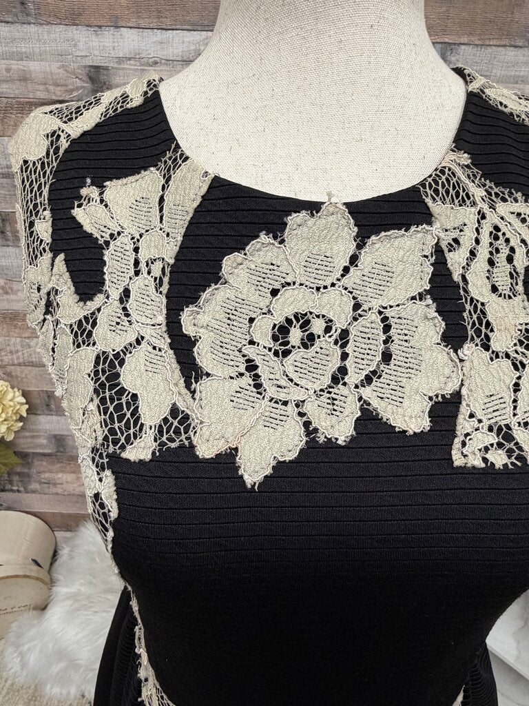 Black cocktail dress with cream lace
