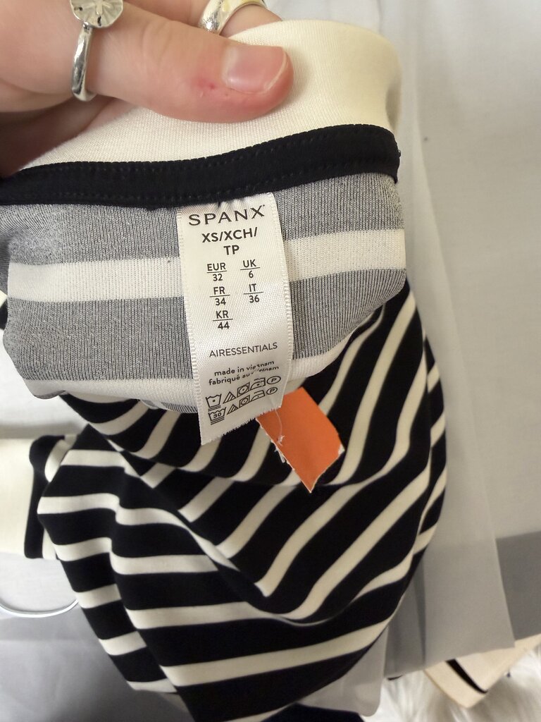 Spanx black with white stripes sweater with cut out shoulder