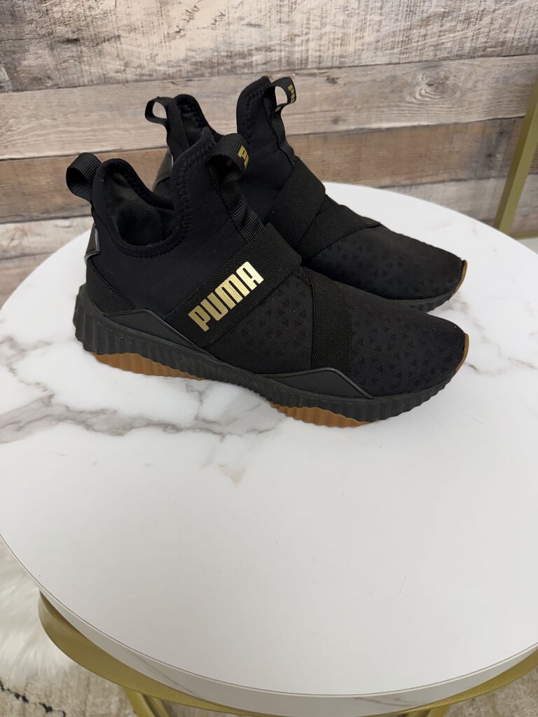 Puma black slip on sneakers