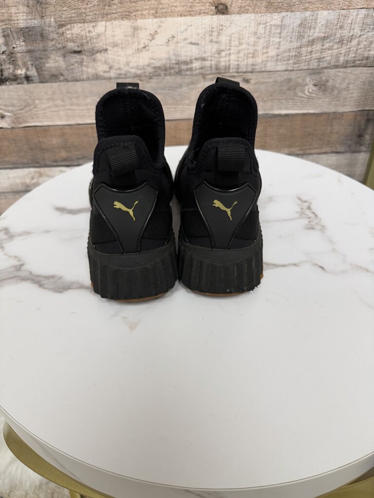 Puma black slip on sneakers